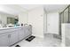Bathroom with double vanity, tile floor, and glass-enclosed shower at 4908 Lotta Ct, St Cloud, FL 34772