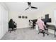 Versatile bedroom or office space, equipped with fan and ample space for gaming setup at 4908 Lotta Ct, St Cloud, FL 34772