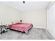 This bedroom provides a cozy atmosphere with soft carpet and a charming accent lamp at 4908 Lotta Ct, St Cloud, FL 34772