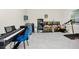 Versatile bonus room featuring a keyboard, aquariums, and potential for various hobbies at 4908 Lotta Ct, St Cloud, FL 34772