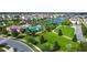Aerial shot of the community amenities with a pool, park, and lush green spaces at 4908 Lotta Ct, St Cloud, FL 34772