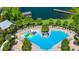 Aerial view of community pool featuring a splashpad, lounge chairs, and beautiful landscaping at 4908 Lotta Ct, St Cloud, FL 34772