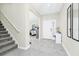 Inviting foyer with staircase and views to the living space is floored with elegant tile at 4908 Lotta Ct, St Cloud, FL 34772