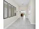 Spacious hallway featuring tile floors, modern mirrors, and an open view to the living area at 4908 Lotta Ct, St Cloud, FL 34772