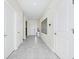 Entryway showcasing modern tile flooring, white doors, and sleek wall decor at 4908 Lotta Ct, St Cloud, FL 34772