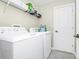 Efficient laundry room featuring modern appliances and practical storage solutions for convenience at 4908 Lotta Ct, St Cloud, FL 34772