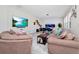 Stylish living room with modern decor, large TV, and comfortable seating, perfect for relaxation at 4908 Lotta Ct, St Cloud, FL 34772