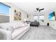 Spacious main bedroom featuring a comfortable lounge area, neutral decor, and lots of natural light at 4908 Lotta Ct, St Cloud, FL 34772