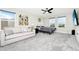 Spacious main bedroom featuring a comfortable lounge area, neutral decor, and lots of natural light at 4908 Lotta Ct, St Cloud, FL 34772