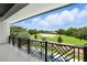 Balcony view of the golf course and outdoor swimming pool at 5074 Isleworth Country Club Dr, Windermere, FL 34786
