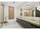 Modern bathroom with double sink, soaking tub, and unique lighting at 5074 Isleworth Country Club Dr, Windermere, FL 34786
