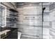 Modern bathroom features floating shelves and a glass enclosed shower with rainfall head at 5074 Isleworth Country Club Dr, Windermere, FL 34786