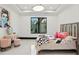 Charming bedroom featuring bright natural light, decorative accents, and stylish furnishings at 5074 Isleworth Country Club Dr, Windermere, FL 34786