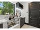 Chic pet wash station complete with marble countertops, a sleek faucet, and convenient enclosure at 5074 Isleworth Country Club Dr, Windermere, FL 34786