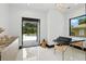 Light and airy interior space with a view to the backyard, plus a massage table at 5074 Isleworth Country Club Dr, Windermere, FL 34786