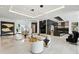 Open-concept living area with modern furnishings, designer lighting, and expansive windows offering views of the indoors at 5074 Isleworth Country Club Dr, Windermere, FL 34786