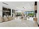 Open-concept living area with modern furnishings, designer lighting, and expansive windows offering views of the outdoors at 5074 Isleworth Country Club Dr, Windermere, FL 34786