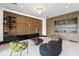 Modern living room with wood accents, stylish furniture, and unique decor at 5074 Isleworth Country Club Dr, Windermere, FL 34786