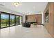 Open-concept living room with sliding glass doors and seamless indoor-outdoor living at 5074 Isleworth Country Club Dr, Windermere, FL 34786