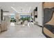 Spacious, bright living room with an open floor plan, modern lighting, and elegant decor with views of the backyard at 5074 Isleworth Country Club Dr, Windermere, FL 34786