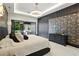 This bedroom boasts unique wall decor and a sliding glass door to a beautiful outdoor view at 5074 Isleworth Country Club Dr, Windermere, FL 34786