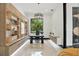 Bright home office with custom built-ins, modern desk, and ample natural light, perfect for productivity at 5074 Isleworth Country Club Dr, Windermere, FL 34786