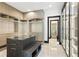 A large walk-in closet with built-in storage and a center island with bench seating at 5074 Isleworth Country Club Dr, Windermere, FL 34786