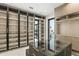 Spacious walk-in closet with shelving and drawers for ample storage and a center island at 5074 Isleworth Country Club Dr, Windermere, FL 34786