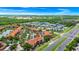 Aerial view of complex with pools, near major highways and commercial developments at 5566 Metrowest Blvd # 10, Orlando, FL 32811
