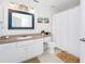 Bright bathroom with vanity and sink, white shower curtain, and decor accents at 5566 Metrowest Blvd # 10, Orlando, FL 32811