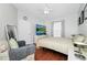 Inviting bedroom featuring wood floors, a ceiling fan, and ample space at 5566 Metrowest Blvd # 10, Orlando, FL 32811