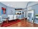 Inviting dining area with modern white chairs, a glass table, and warm wood flooring at 5566 Metrowest Blvd # 10, Orlando, FL 32811