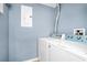 Functional laundry area equipped with a washer, dryer, and utility connections at 5566 Metrowest Blvd # 10, Orlando, FL 32811