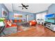 Inviting living room featuring a gray sectional sofa and a flatscreen TV at 5566 Metrowest Blvd # 10, Orlando, FL 32811