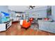 Cozy living room with modern furnishings, hardwood floors, and an open-concept design at 5566 Metrowest Blvd # 10, Orlando, FL 32811