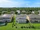 Aerial view of the property showcasing the backyard, patio, and surrounding neighborhood at 5819 Covington Cove Way, Orlando, FL 32829