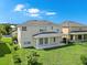 Spacious backyard with a covered patio, perfect for entertaining and outdoor living at 5819 Covington Cove Way, Orlando, FL 32829