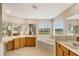 Large bathroom with double sinks, tub, and window with a view at 5819 Covington Cove Way, Orlando, FL 32829