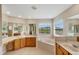 Large bathroom with double sinks, tub, and window with a view at 5819 Covington Cove Way, Orlando, FL 32829
