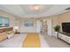 Primary bedroom featuring paintings, a plant, and neutral colored walls at 5819 Covington Cove Way, Orlando, FL 32829