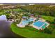 Aerial view of a large community pool, lazy river, lap pool, and lounge seating at 5819 Covington Cove Way, Orlando, FL 32829