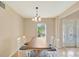 Cozy dining room with a wood table and seating for six at 5819 Covington Cove Way, Orlando, FL 32829