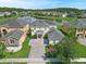 Lovely two-story home with manicured lawn located on lake at 5819 Covington Cove Way, Orlando, FL 32829