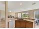 Kitchen view showing breakfast nook and open layout to living area at 5819 Covington Cove Way, Orlando, FL 32829
