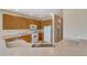 The kitchen features tile countertops, wooden cabinets and modern appliances offers a practical cooking space at 5819 Covington Cove Way, Orlando, FL 32829