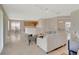 Bright, open-concept living area featuring neutral tones, tile flooring, and natural light at 5819 Covington Cove Way, Orlando, FL 32829