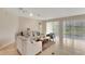 Bright living room with tiled flooring, plush seating, a coffee table and access to the outdoor with ample light at 5819 Covington Cove Way, Orlando, FL 32829