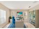 Bright office space with a desk, chair, and ample storage at 5819 Covington Cove Way, Orlando, FL 32829