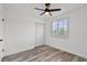 Bedroom featuring a closet, window with shutter blinds, ceiling fan, and plank flooring at 608 Pearl Rd, Winter Springs, FL 32708