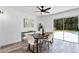 Dining area featuring modern table and chairs, open to backyard at 608 Pearl Rd, Winter Springs, FL 32708